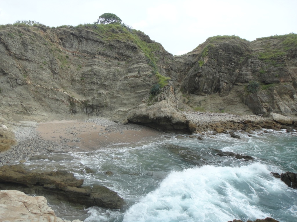 Hidden cove only accessible at low tide or by climbing