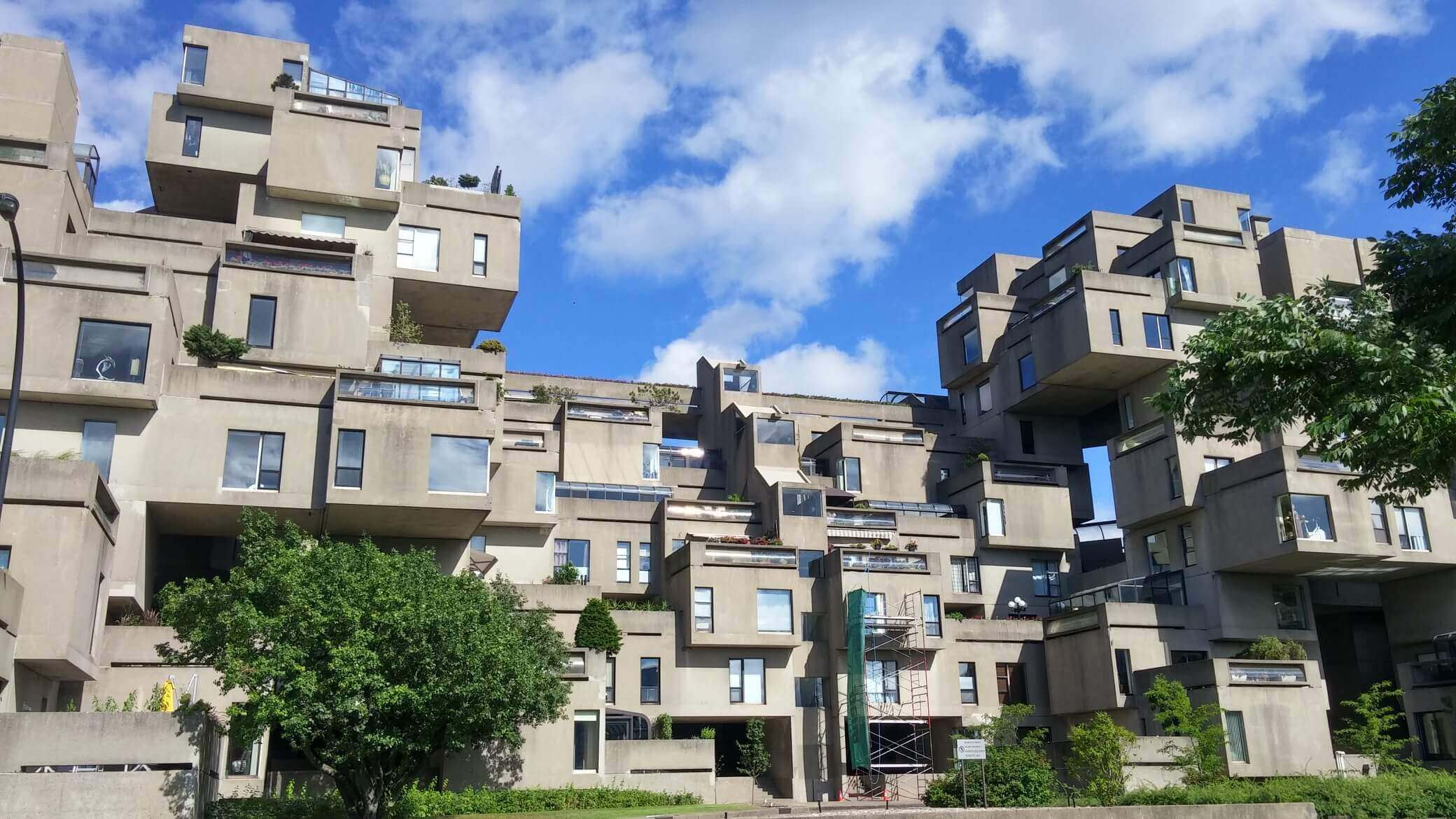 Habitat 67, also built for Expo 67, was originally conceived as graduate dissertation. The concept was to build affordable, modular housing that could take on all sorts of novel configurations using the same basic building block, a concrete cube. Unfortunately, the experiment didn't end up working out since people found the units highly desirable and were willing to pay more to live there, plus each concrete cube ended up costing $140,000 to fabricate